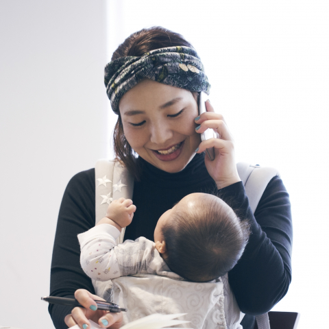Mom with baby talking on phone